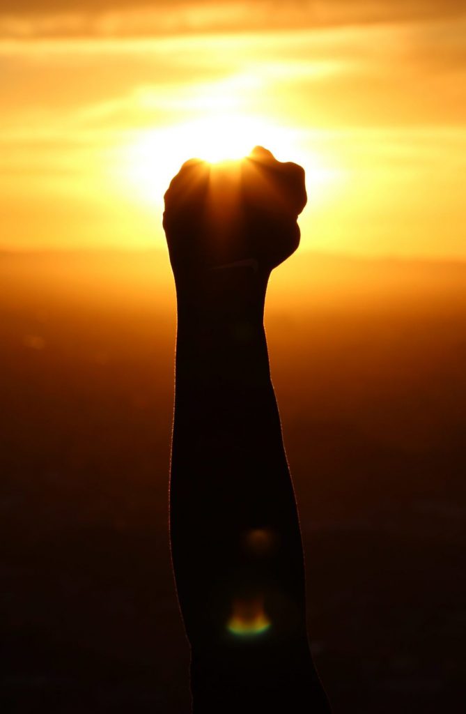 Strengthening Our Mental Toughness to Achieve Real Change: Person celebrating their success